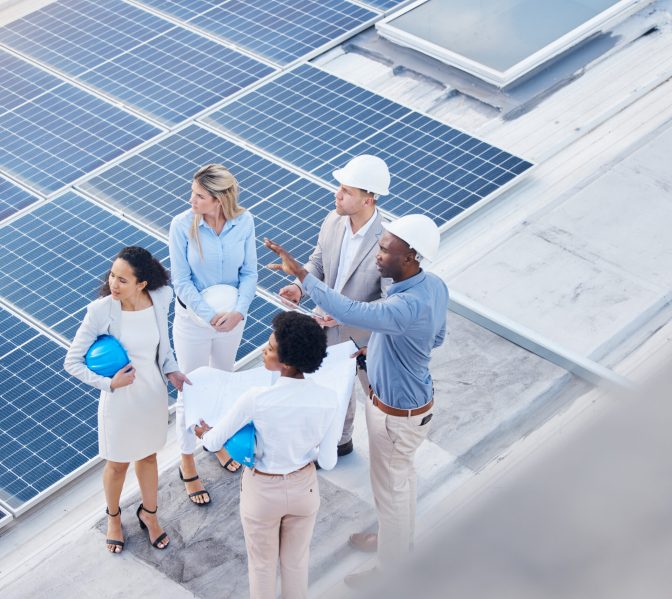 solar-energy-teamwork-or-engineering-team-on-roof-2025-04-06-12-32-33-utc Solar energy, teamwork or engineering team on roof by solar panels for electricity technology innov.